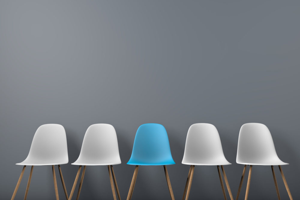 Row of chairs with one odd one out. Job opportunity. Business leadership. recruitment concept. 3D rendering